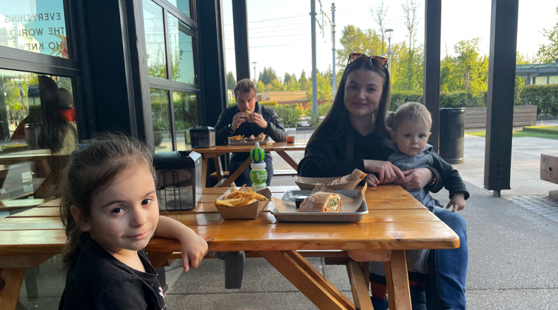 A young mother and her two children enjoy dinner outside at Tanaka restaurant on Civic Drive in Gresham.