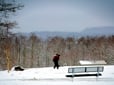 People walking in snow at Shane T. Bemis Nature Park.